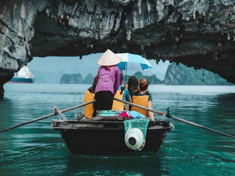 Explore caves by bamboo boat in Halong bay - Hanoi Explore Travel